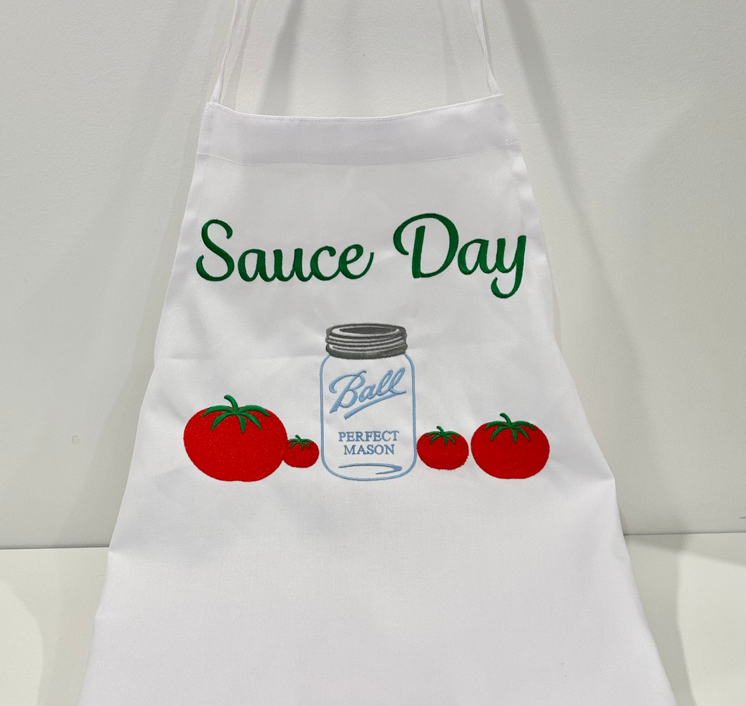 Apron with tomato and mason jar all embroidered for your next italian sauce or tomato day.