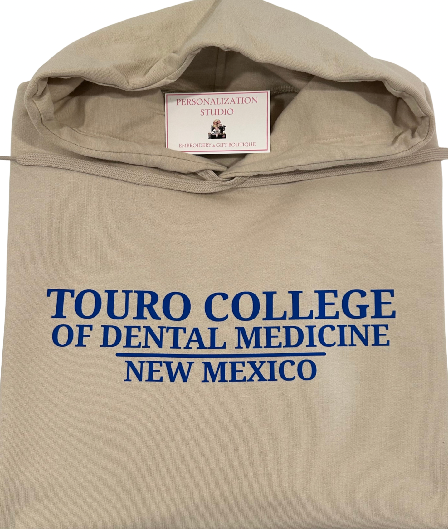 beige hoodie with blue font