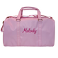 Pink duffle bag monogrammed with name. perfect for travel, after school sports, gym or overnight bag. Made of durable wipeable nylon, gold hardware, inner inside zipper pocket.