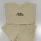 Beige kids shorts set with 'Millie' embroidered. 100% cotton drawstring waist and perfect for the next playdate. available in other colors 