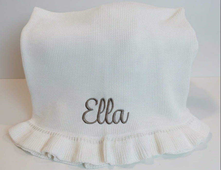 white knit baby blanket embroidered with name in taupe thread. Perfect for a newborn gift and will be a keepsake for years to come 