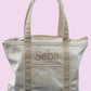 CB station beige trim medium tote. Name embroidered for a personalized look. Outr pocket and inner zipper pocket with top zipper. a very useful tote they will love.