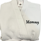A white waffle-weave bathrobe embroidered with the word 'Mommy' embroidered in navy on the chest. Personalized embroidered robes are the best gifts for bridal showers, college gifts, birthday gifts or housewarming gifts.