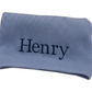 BLUE KNIT BABY BANKET STRAIGHT EDGE MONOGRAMMED WITH NAME IN NAVY BLUE THREAD FONT IS CALLED GEORGIA