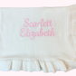 White baby blanket with soft ruffle edge and embroidered name with pink thread 