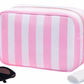 Pink & white nylon stripe bag with gold hardware. Has inside zipper pocket and fringe at toggle for easy opening.