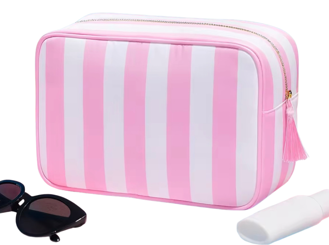 Pink & white nylon stripe bag with gold hardware. Has inside zipper pocket and fringe at toggle for easy opening.