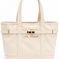 Natural canvas tote bag with double top handles, a decorative horizontal strap with gold-tone hardware, and the name 'Mrs. Daniele' embroidered on the front pocket. Perfect engagement gift for the future bride. 